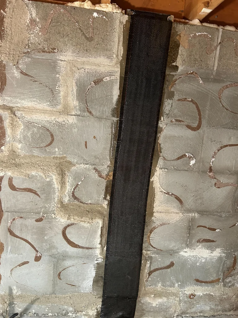 Carbon fiber straps installed on bowing crawlspace wall in Cranberry Twp PA