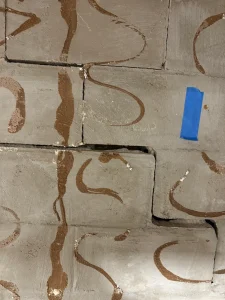Bowing crawlspace foundation wall before carbon fiber strap repair in Cranberry Twp PA