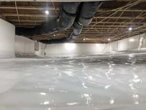 Encapsulated crawl space with vapor barrier and moisture control system to prevent mold growth and improve indoor air quality