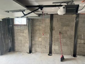 Foundation repair cost estimate example showing structural wall supports installed along a concrete block basement wall